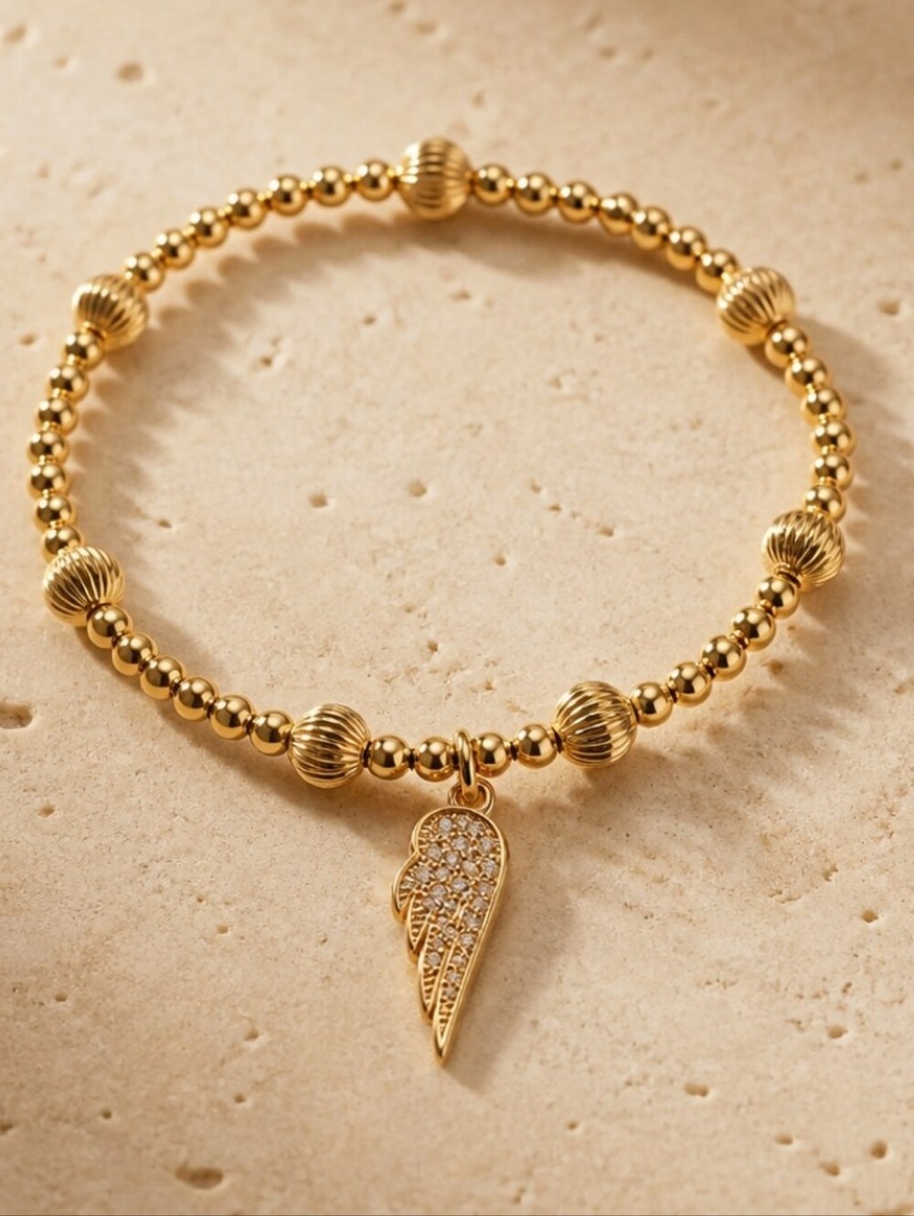 Gold Beaded Angel Wing Charm Bracelet